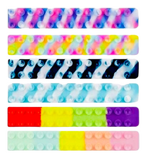 Load image into Gallery viewer, Grip Strips Popping Suction Toy
